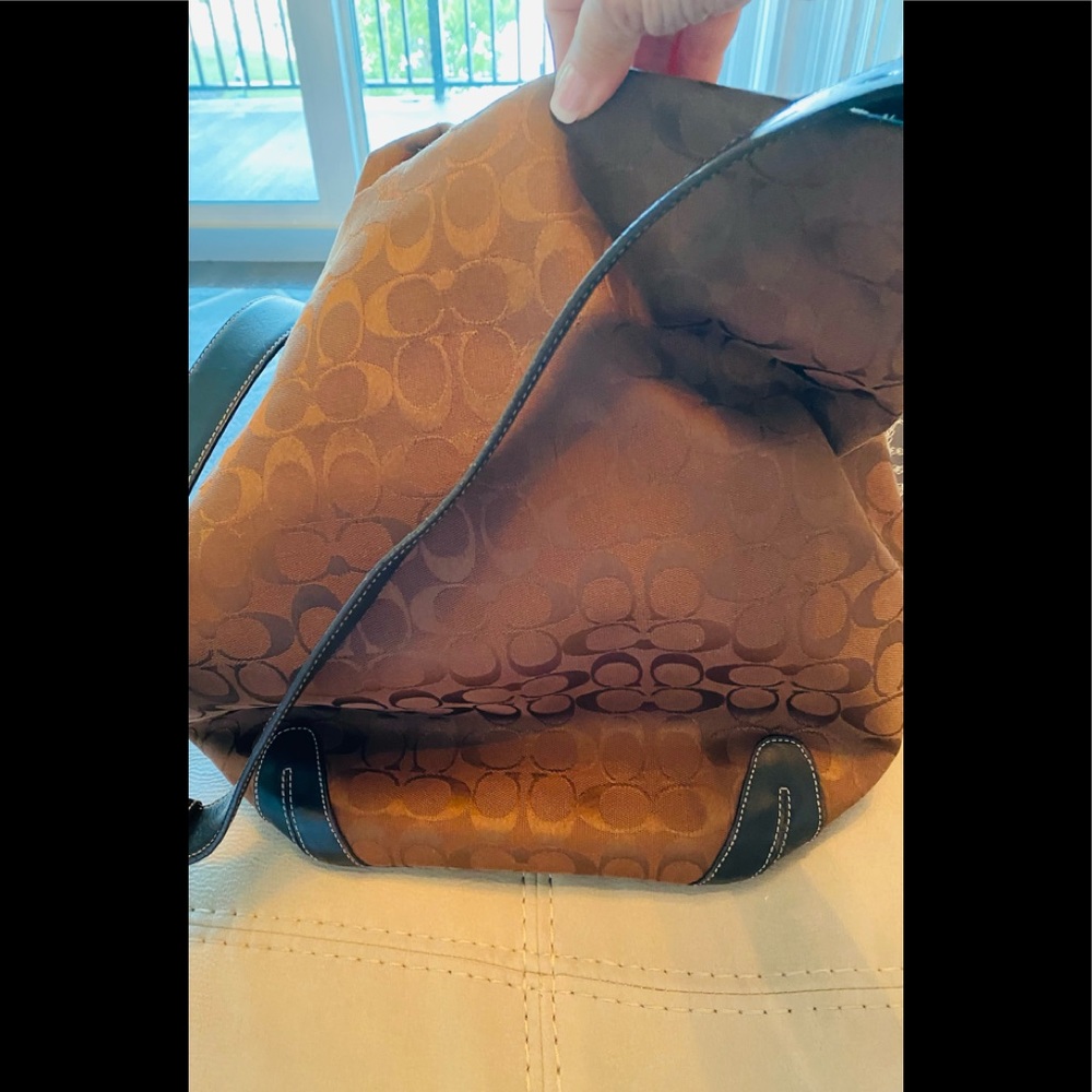 Beautiful Coach bucket purse with matching wallet.